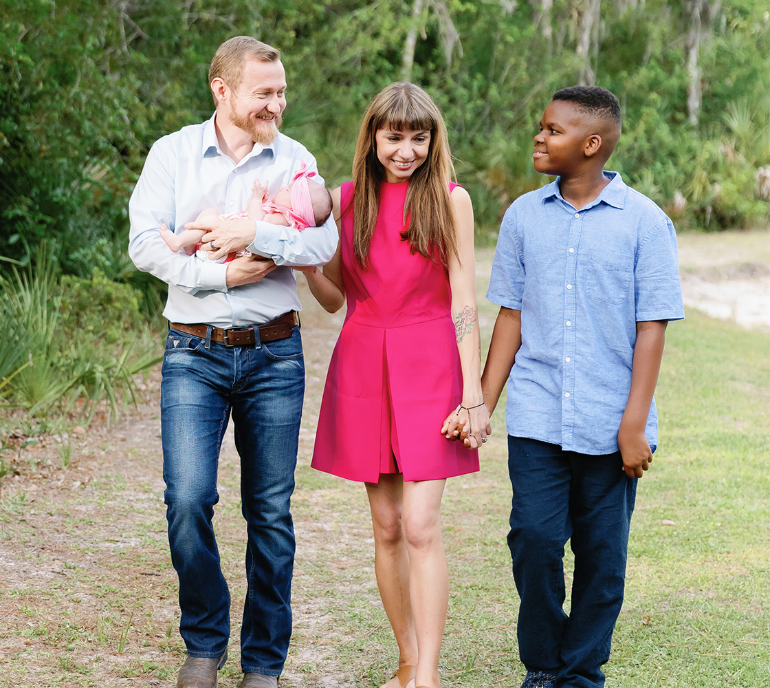 Joshua Wostal with his wife Noelle and their children